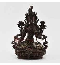 Hand Carved Green Tara Statue in Oxidation and and Decorated with Silver Plates